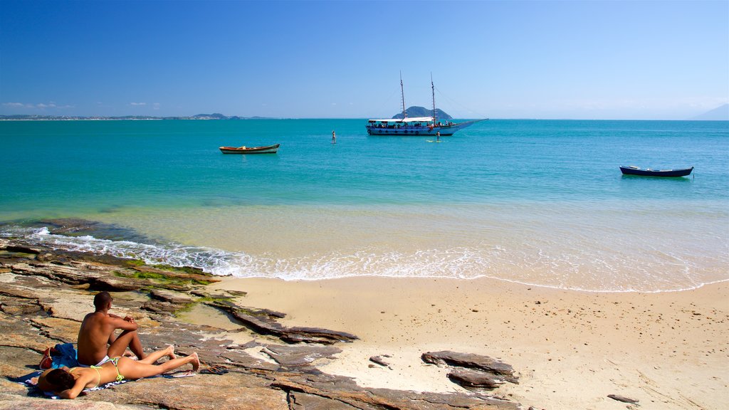 Azeda Beach showing general coastal views and a sandy beach as well as a couple