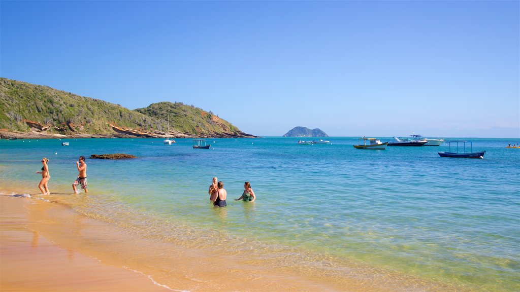 Joao Fernandes Beach which includes rugged coastline, general coastal views and a sandy beach