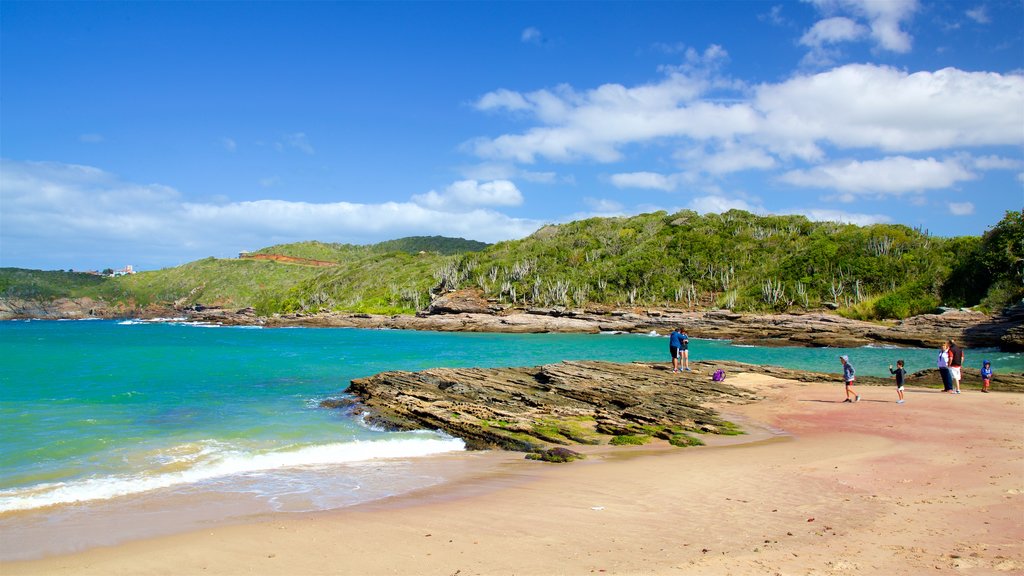 Forno Beach showing a sandy beach, rugged coastline and general coastal views