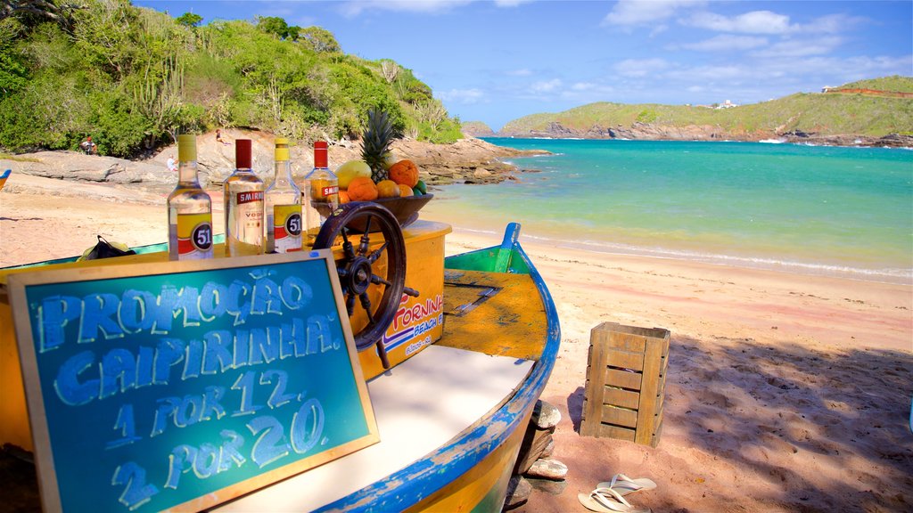 Forno Beach showing a beach, a beach bar and drinks or beverages