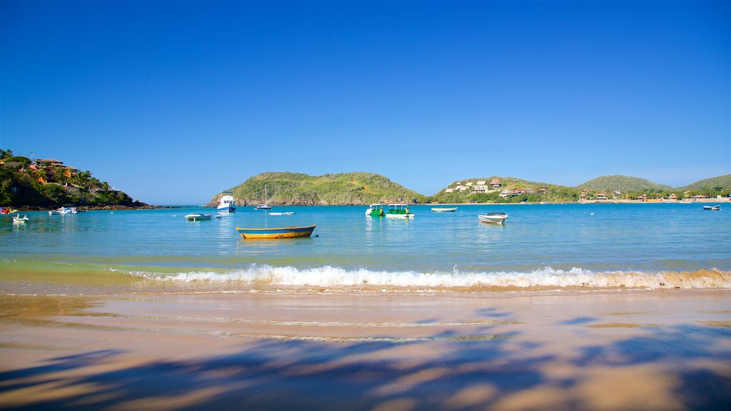 Ferradura Beach which includes general coastal views and a sandy beach