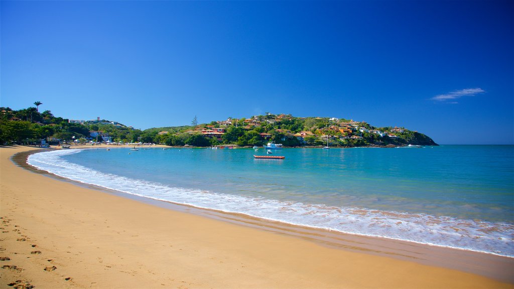 Ferradura Beach which includes general coastal views and a sandy beach