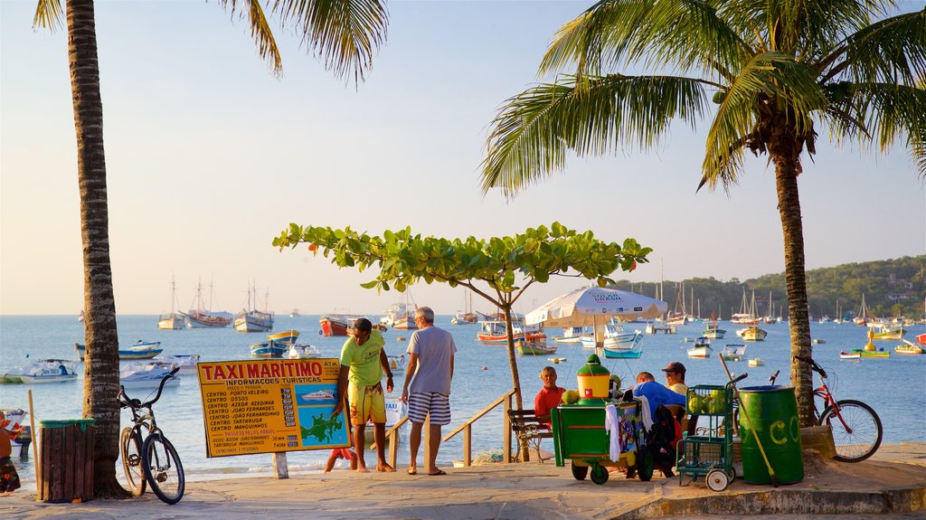 Orla Bardot featuring signage, general coastal views and a bay or harbour