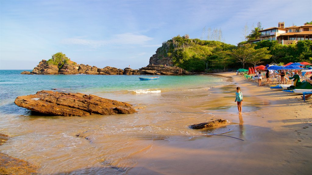 Ferradurinha Beach which includes general coastal views, rocky coastline and a sandy beach