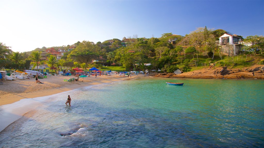 Ferradurinha Beach which includes a coastal town, general coastal views and a sandy beach