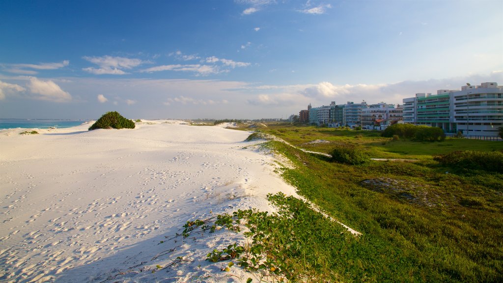 Dunas Beach showing a coastal town, general coastal views and a beach