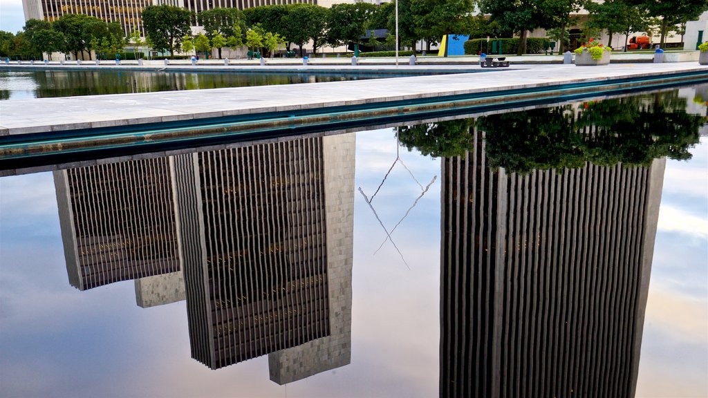 Governor Nelson A. Rockefeller Empire State Plaza showing a skyscraper, a pond and a city