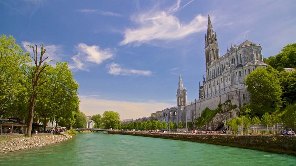 Notre-Dame de l\'Immaculee-Conception featuring heritage architecture, a church or cathedral and a river or creek