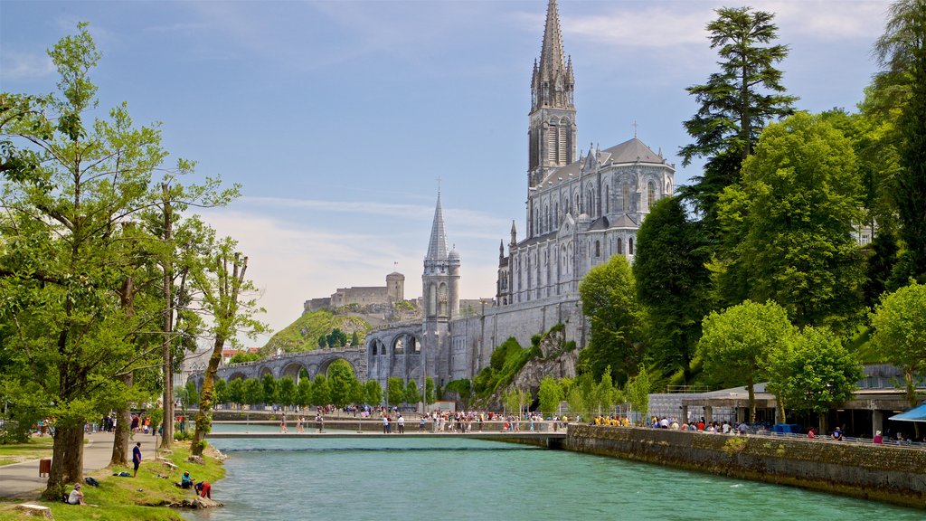 Notre-Dame de l\'Immaculee-Conception featuring a church or cathedral, heritage architecture and a river or creek