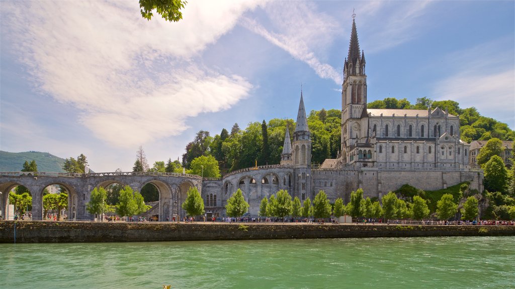 Notre-Dame de l\'Immaculee-Conception featuring a church or cathedral, a river or creek and heritage architecture