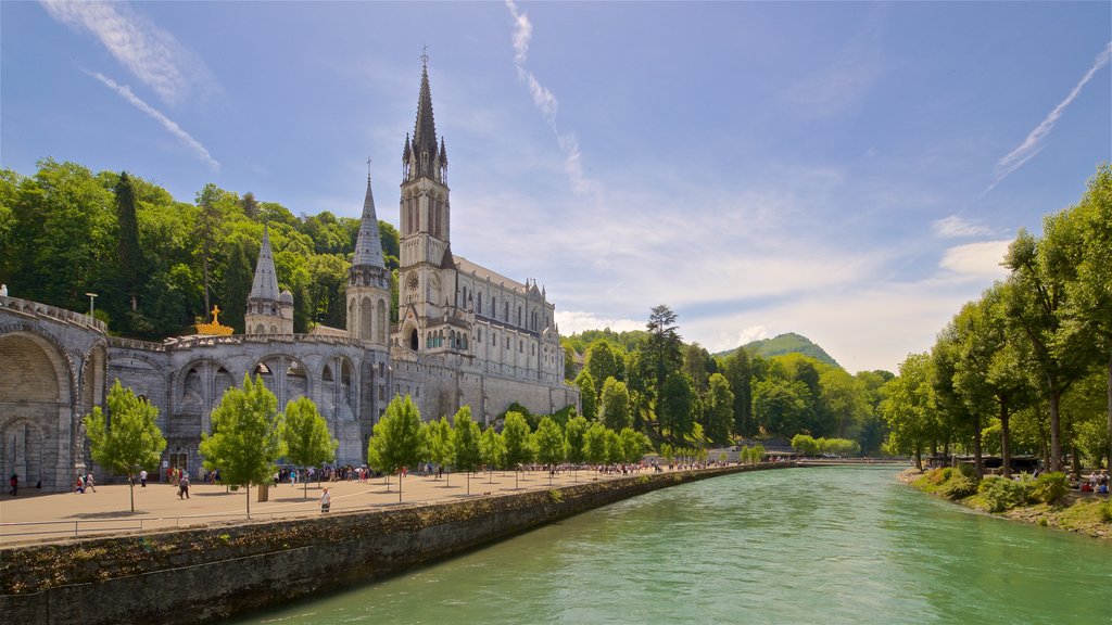 Notre-Dame de l\'Immaculee-Conception featuring a church or cathedral, a river or creek and heritage architecture