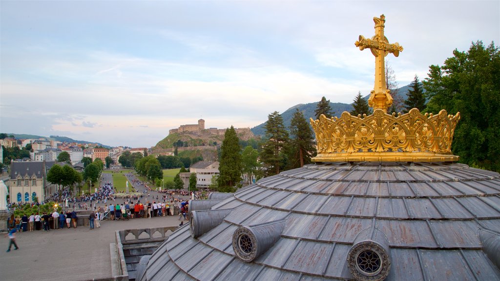 Rosary Basilica which includes religious elements and landscape views as well as a large group of people