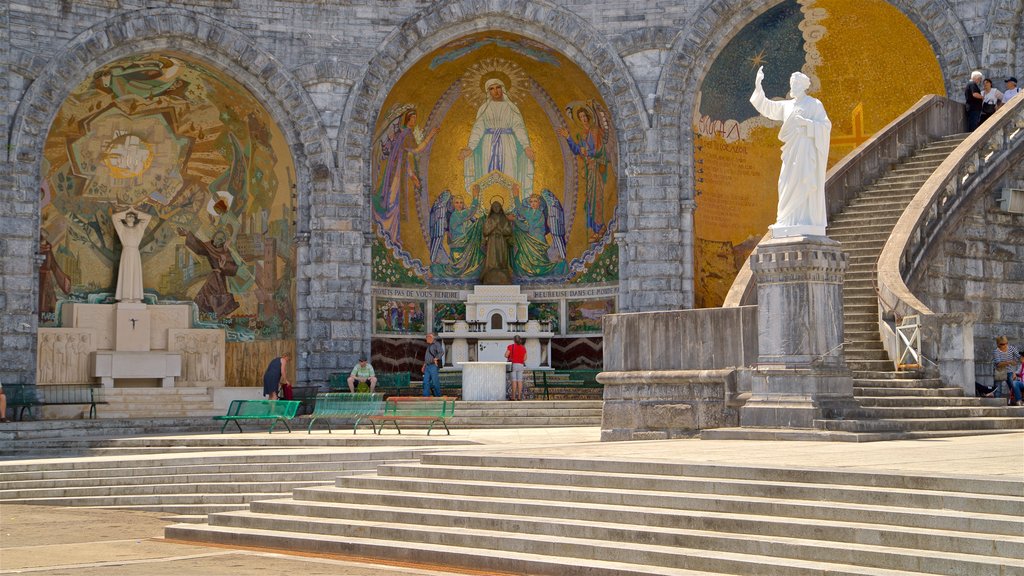 Rosary Basilica featuring art, religious aspects and a statue or sculpture