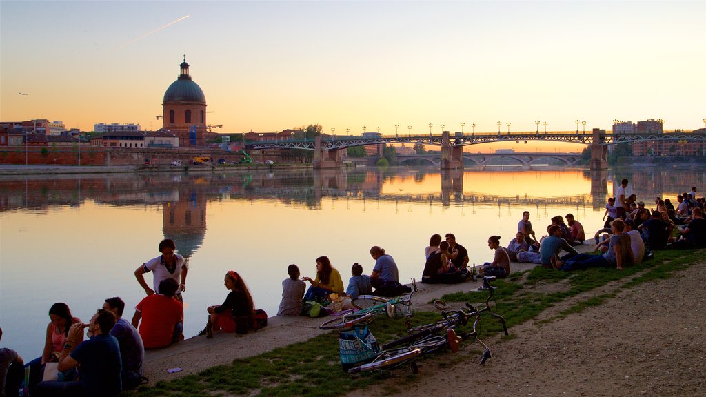 Garonne featuring a river or creek, a sunset and heritage architecture