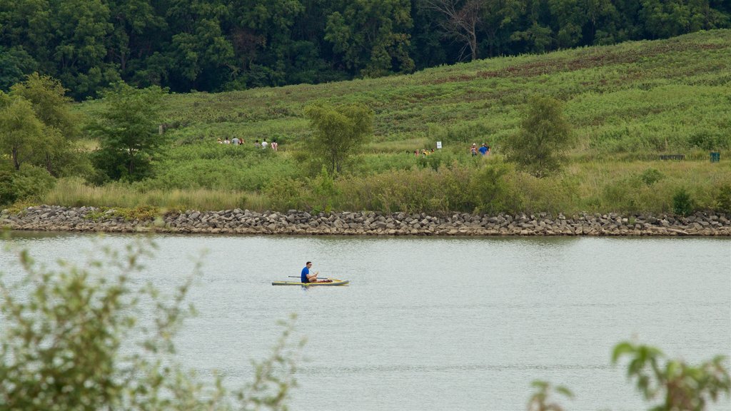 Zorinsky Lake Park showing kayaking or canoeing and a river or creek as well as an individual male