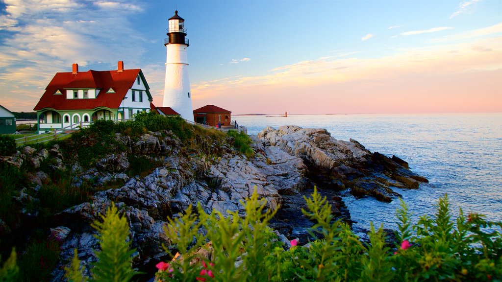 Portland Head Light which includes a sunset, a lighthouse and rugged coastline