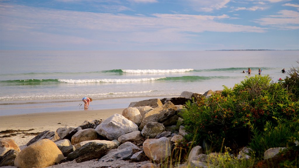 Higgins Beach featuring general coastal views and a beach as well as a small group of people