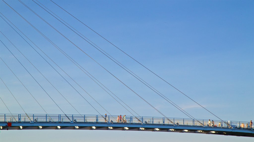 Bob Kerrey Pedestrian Bridge showing a bridge as well as a small group of people