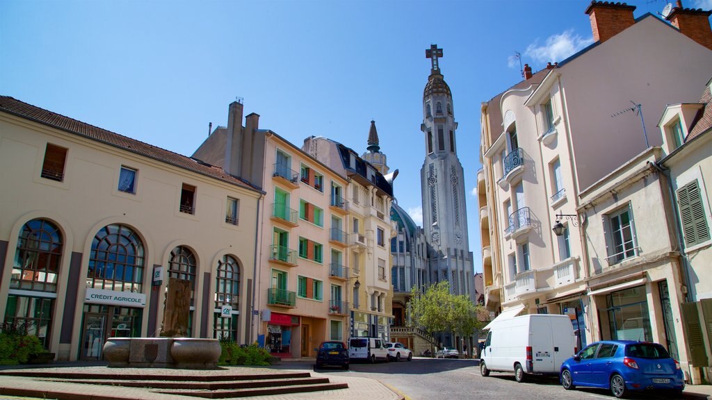 Église St-Blaise showing heritage architecture and a city