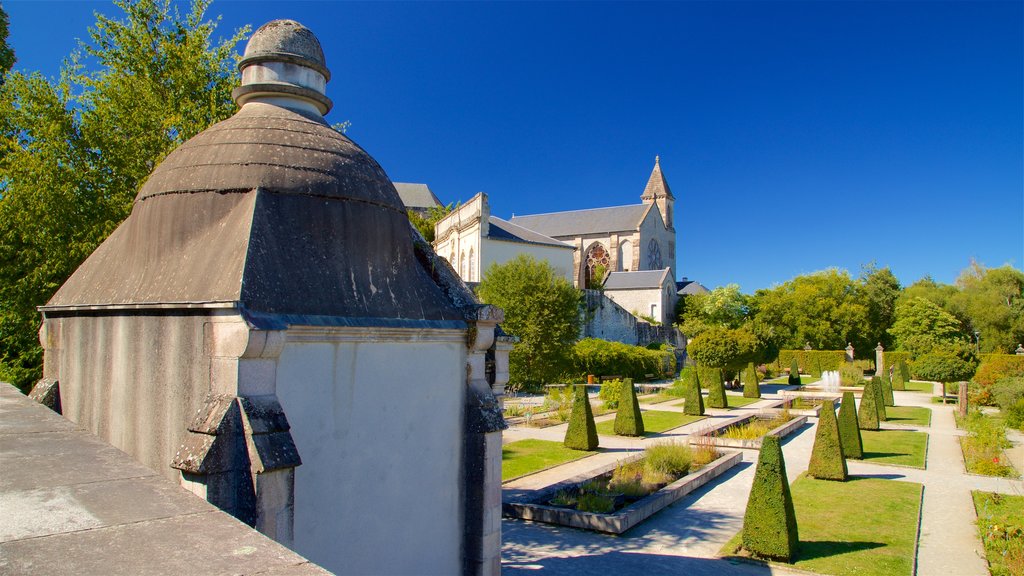 Jardin de l\'Eveche showing a church or cathedral, a garden and heritage elements