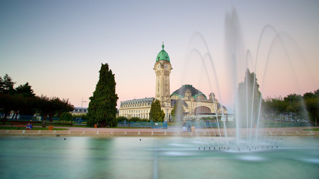 Gare de Limoges featuring a fountain, a sunset and heritage architecture