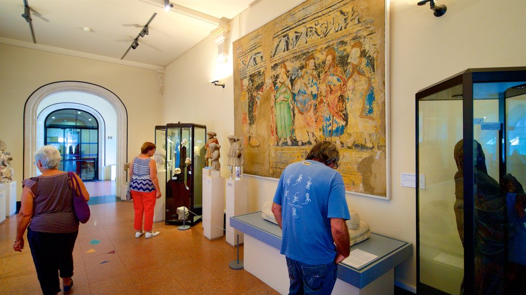 Musee Anne de Beaujeu showing interior views as well as a small group of people