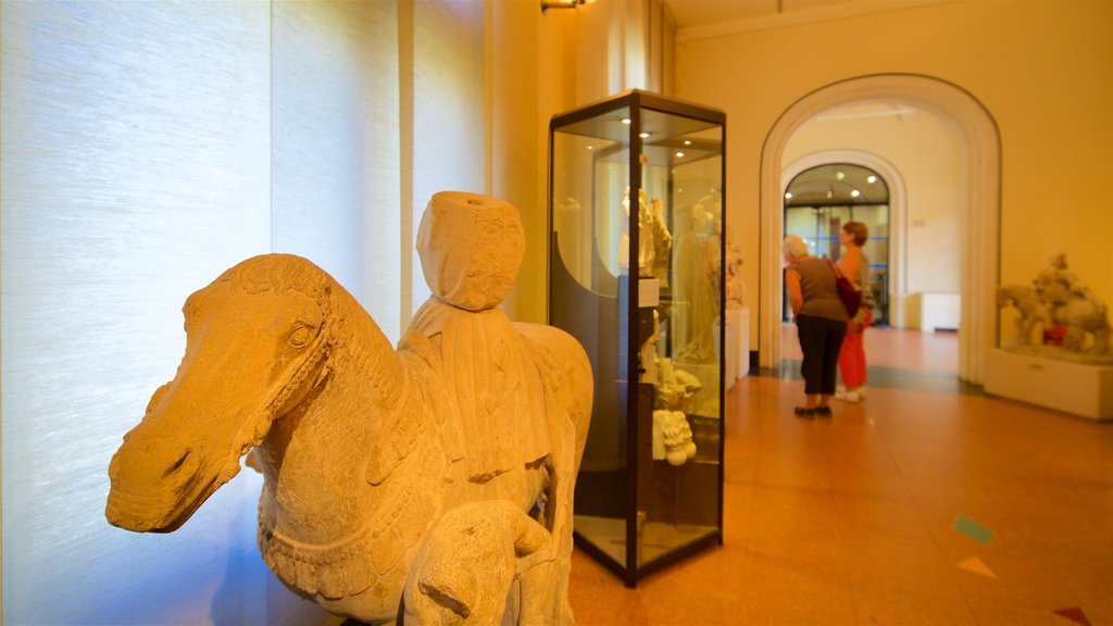 Musee Anne de Beaujeu showing interior views as well as a small group of people