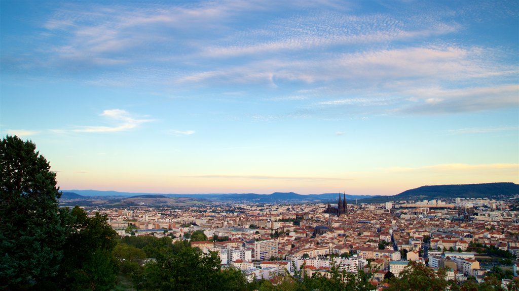 Montjuzet Park showing a sunset, a city and a church or cathedral