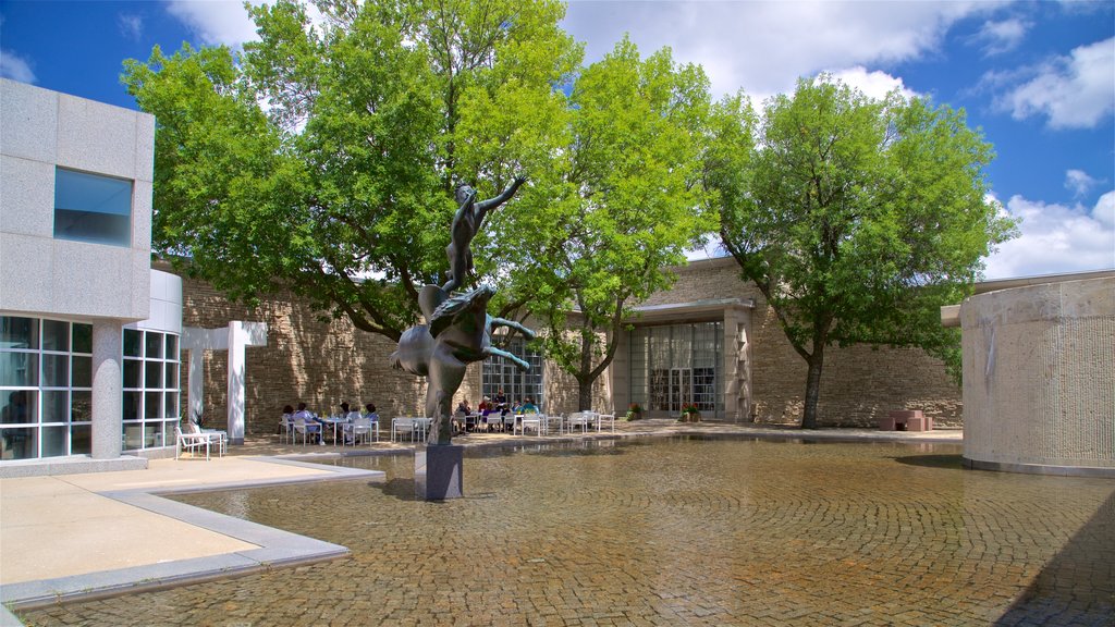 Des Moines Art Center showing outdoor art and a pond