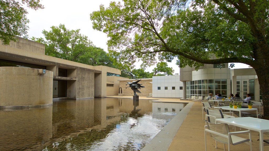 Des Moines Art Center showing a pond, outdoor art and outdoor eating