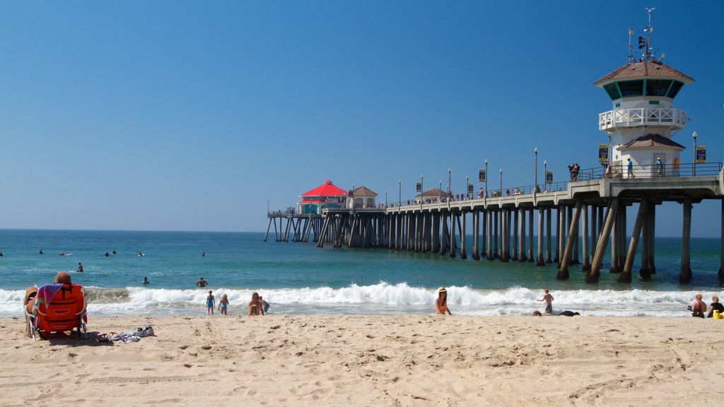 Huntington Beach showing a beach, landscape views and a lighthouse