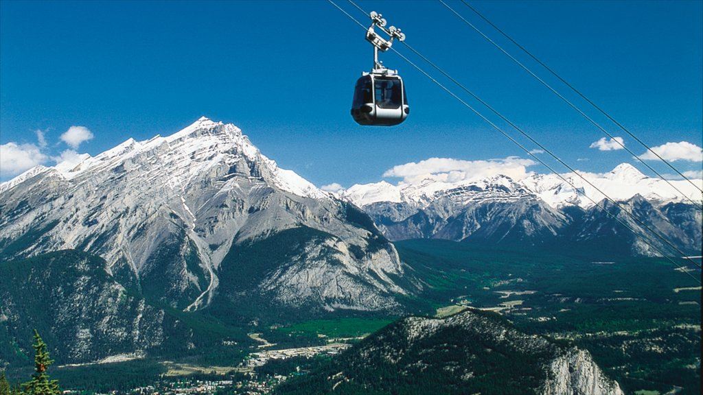 Banff Gondola showing mountains, snow and a gondola