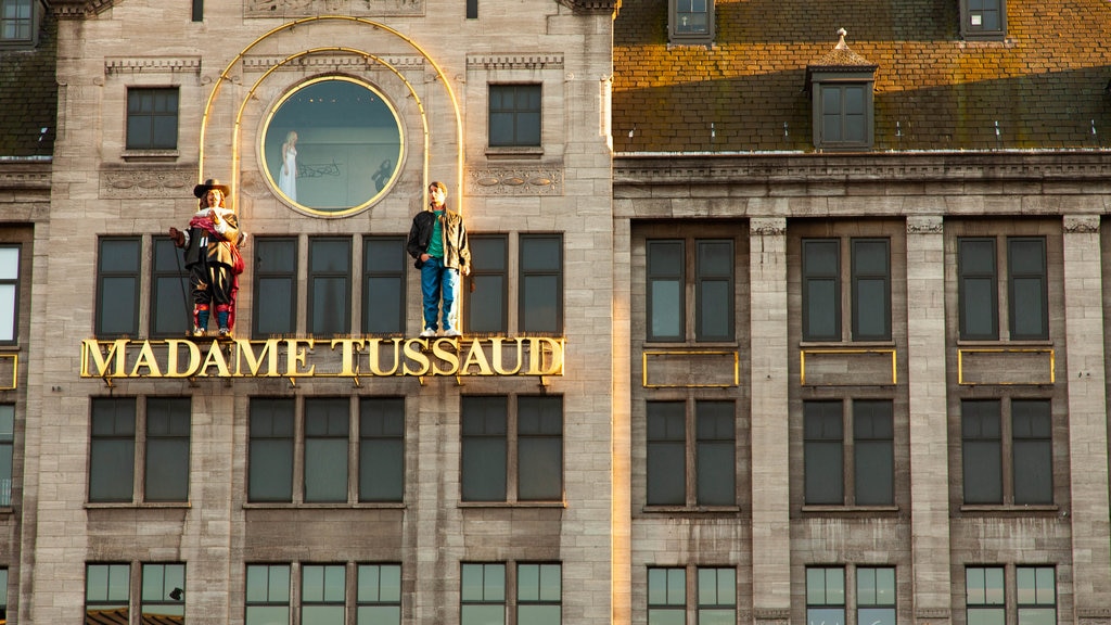 Dam Square featuring signage and a city