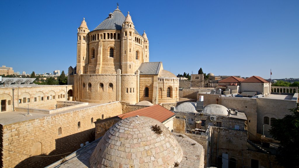 Dormition Abbey showing heritage architecture and a city