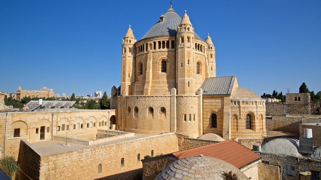 Dormition Abbey showing heritage architecture and a city