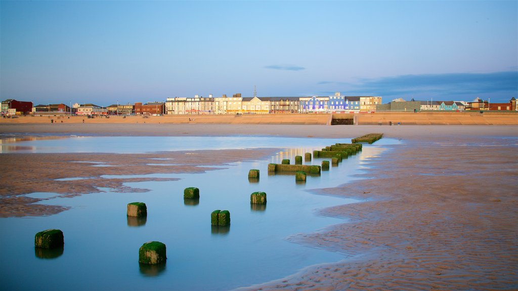 Central Beach which includes general coastal views, a coastal town and a sandy beach