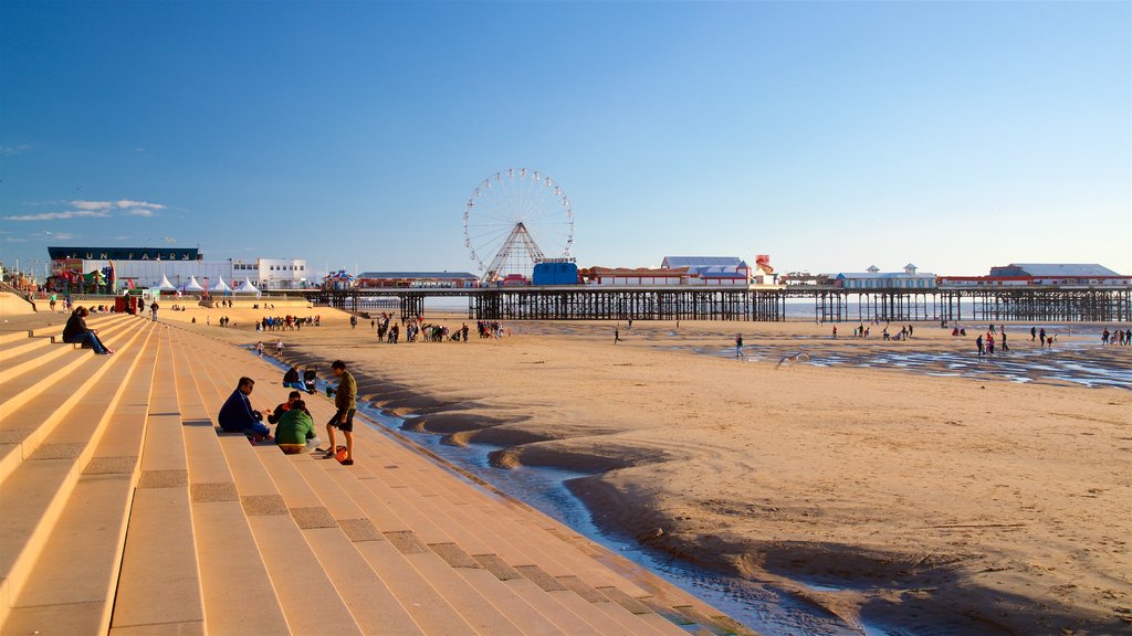 Blackpool Beach showing general coastal views and a beach as well as a small group of people