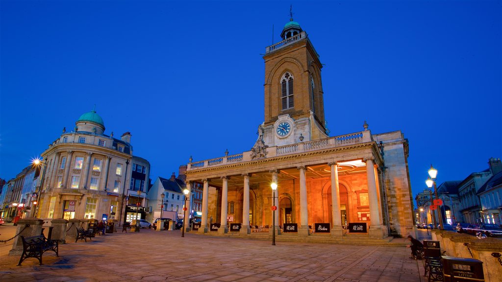 All Saints Church which includes a square or plaza, night scenes and heritage architecture