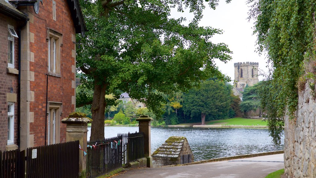 Melbourne showing a pond, a garden and a small town or village