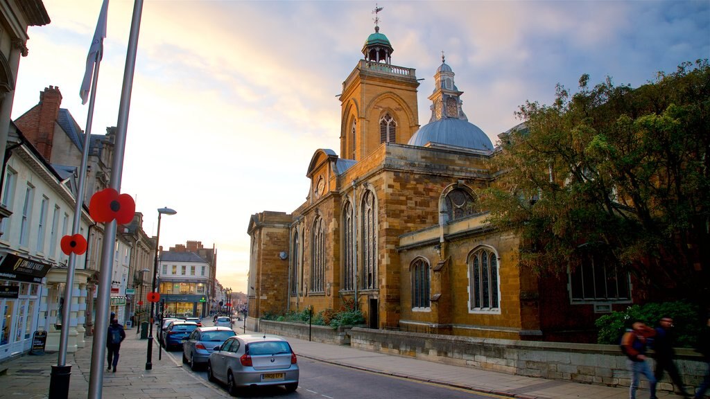 All Saints Church which includes heritage architecture and a sunset