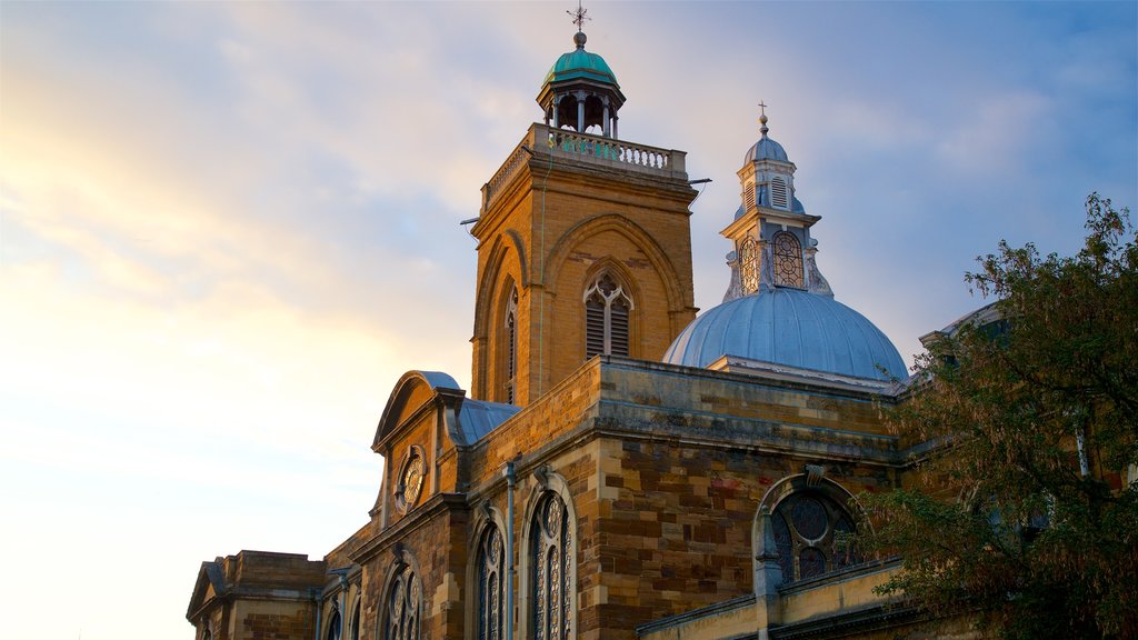 All Saints Church showing heritage architecture, a sunset and a church or cathedral