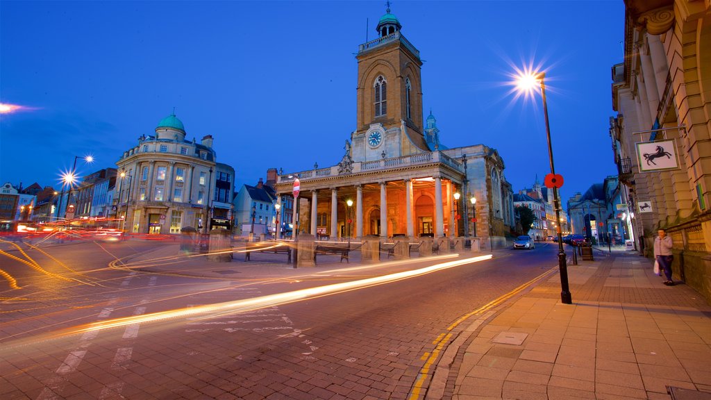 All Saints Church which includes night scenes, a city and heritage architecture