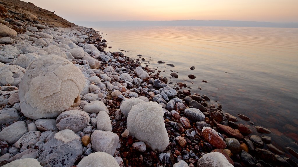 Mujib Nature Reserve featuring general coastal views, a pebble beach and a sunset