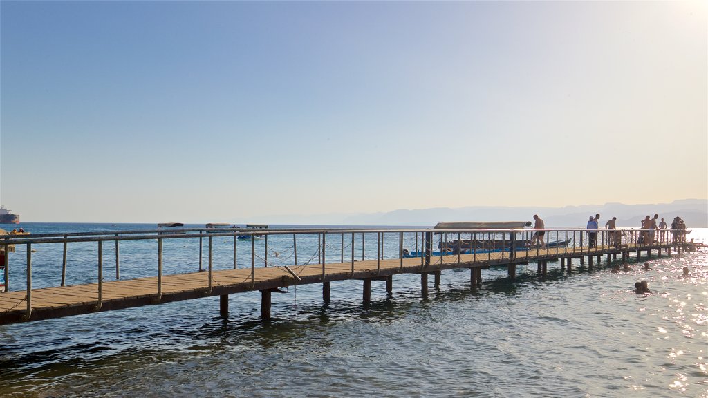 Aqaba featuring general coastal views as well as a small group of people