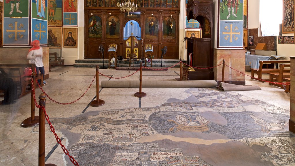 Basilica of Saint George featuring a church or cathedral, religious elements and interior views