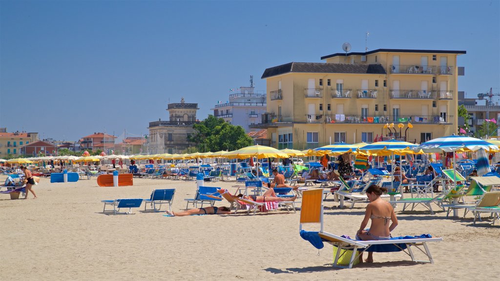 Viserbella mostrando vista general a la costa y una playa y también una mujer