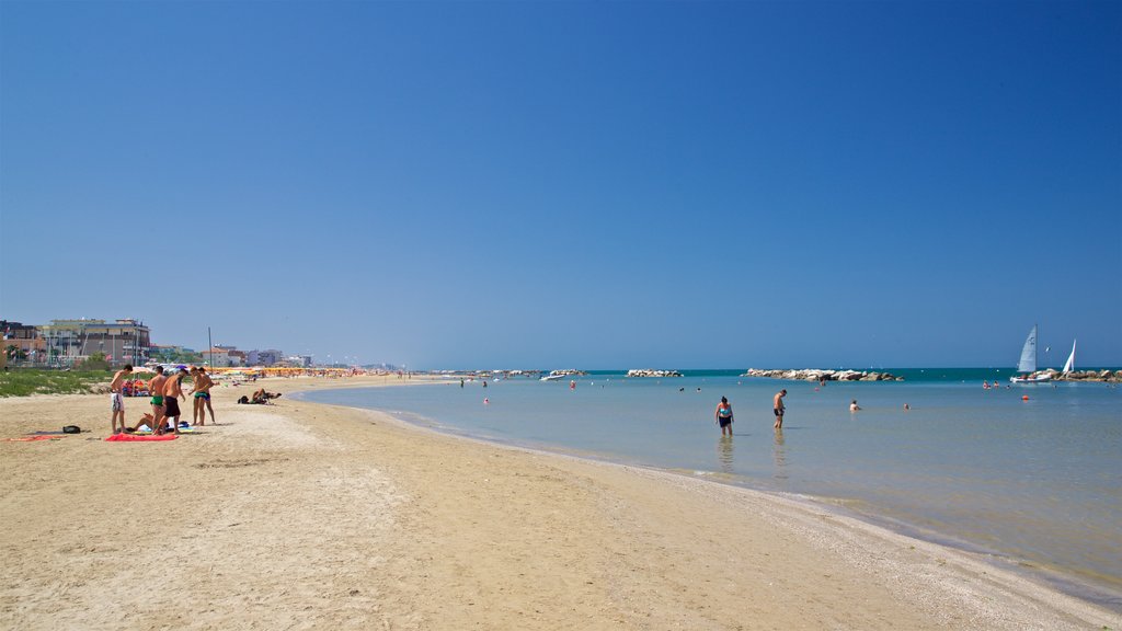 Viserbella showing general coastal views, swimming and a beach