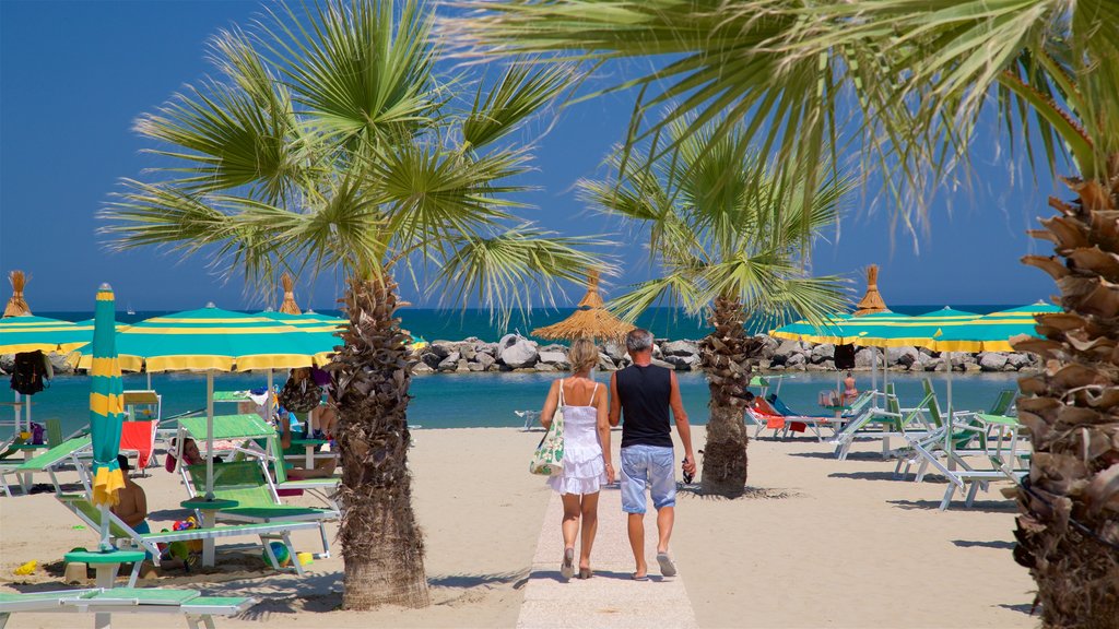 Torre Pedrera showing a beach and general coastal views as well as a couple