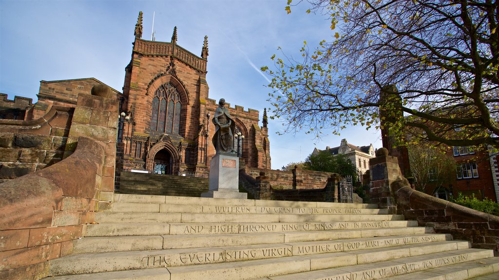 Wolverhampton showing a church or cathedral, a statue or sculpture and heritage architecture