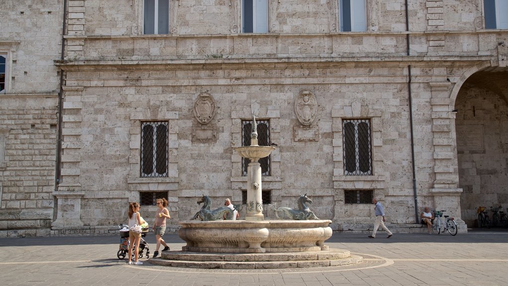 Piazza Arringo which includes a fountain, street scenes and heritage elements